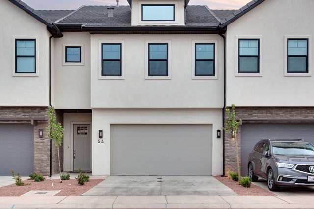 Two-story front of Ocotillo Springs 54 with two-car garage
