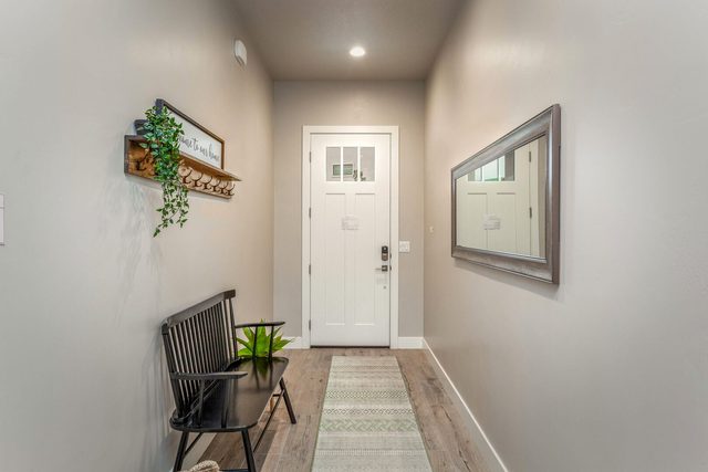 Front entry hallway with bench and wall mirror