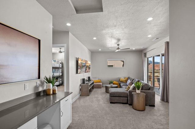 Upstairs family room with sectional and TV