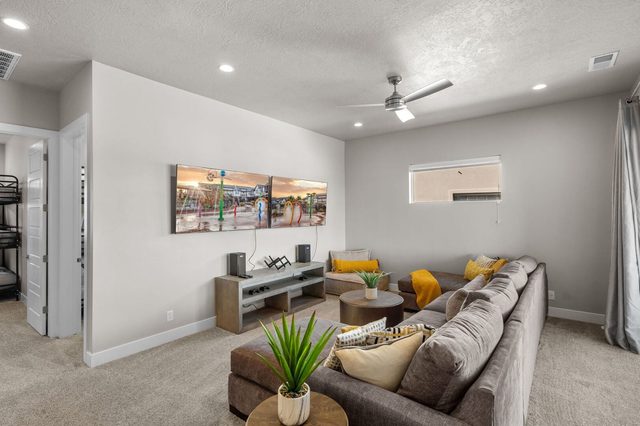 Upstairs family room sectional with bunk room beyond