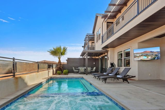 Private pool and hot tub with outdoor TV on patio