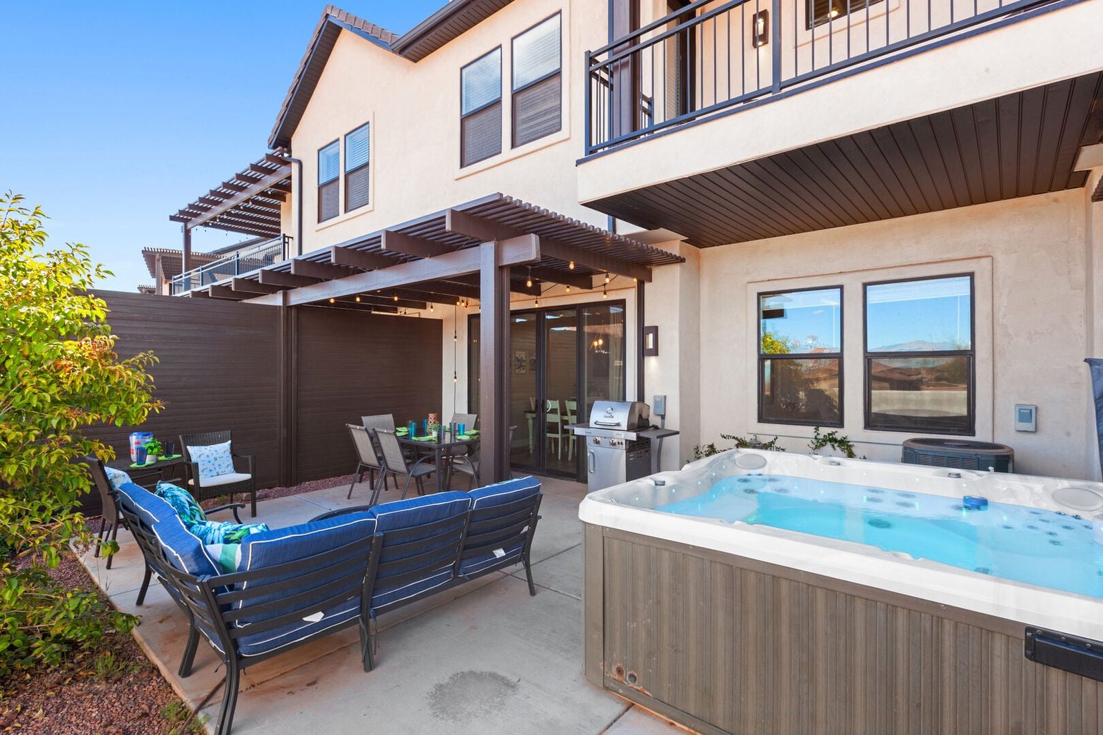 Back patio with private hot tub, sectional and covered pergola