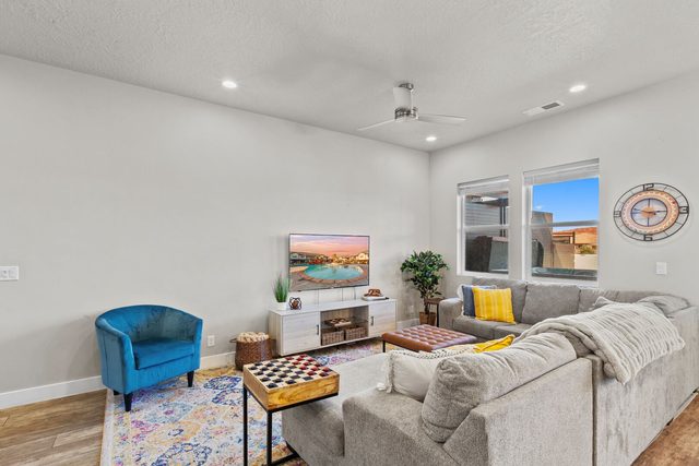 Living room seating area with blue accent chair and sectional