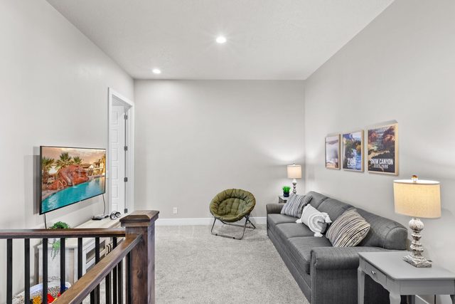 Upstairs loft with sofa and wall-mounted TV at Ocotillo Springs 69