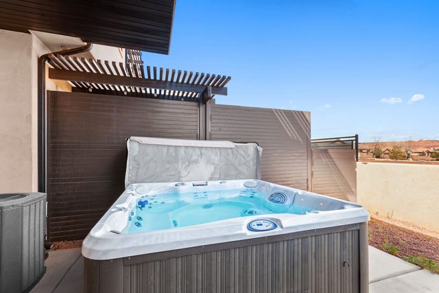 Private hot tub on the fenced back patio