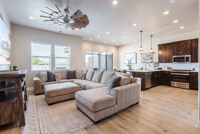 Living room sectional open to the kitchen and dining area