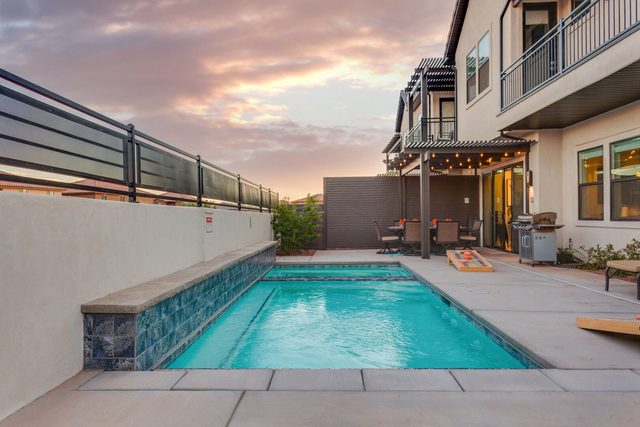 Private pool along the patio behind The Lookout at dusk