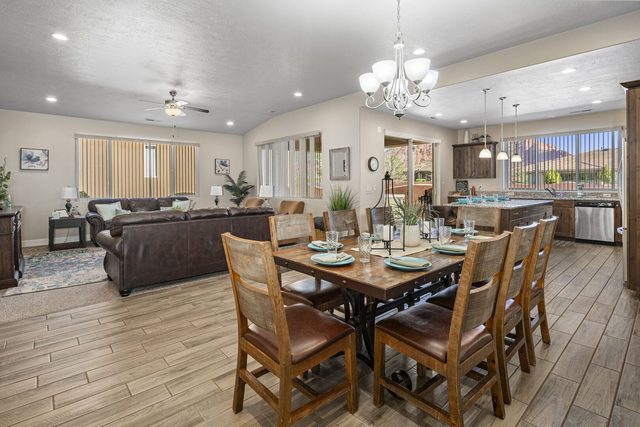 Open living and dining area with leather sofas at Paradise Village 10