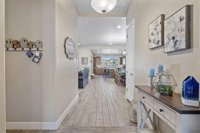 Entry hallway with console table leading to the kitchen at Paradise Village 10