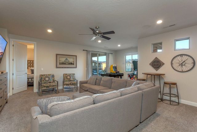Upstairs loft with large sectional sofa and bar table