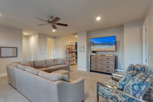 Loft sectional facing a smart TV and dresser