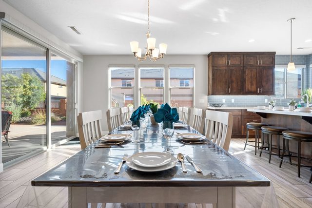Dining table for a large group next to the kitchen island