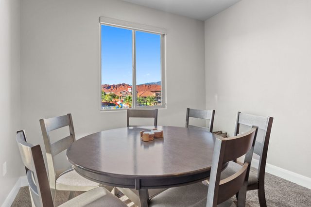 Upstairs round table with six chairs by the window