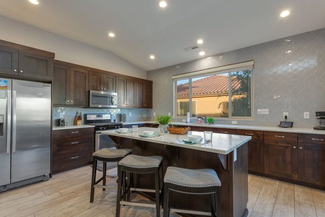 Kitchen island with bar stools at Paradise Village 111