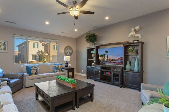 Living room with sectional sofa, leather recliner and entertainment center
