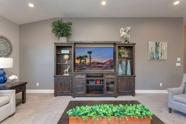 Living room entertainment center with TV and large coffee table