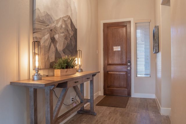 Entry with wood console table and front door