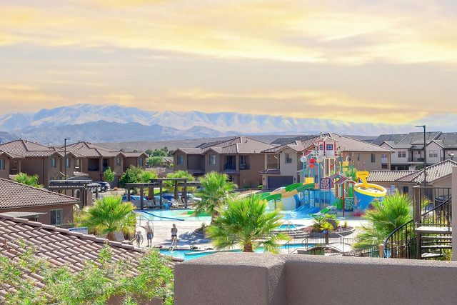 Sunset view over the resort water park and mountains from the rooftop deck