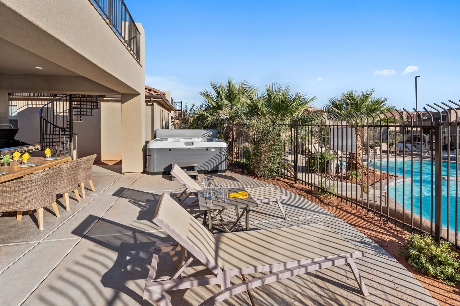 Back patio with private hot tub and dining table at Paradise Village 115