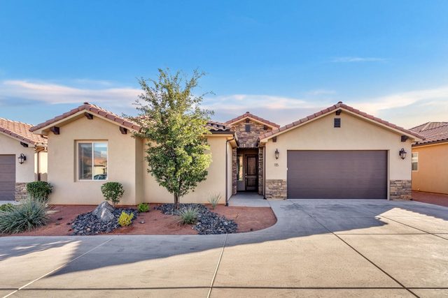 Front exterior and two-car garage of Paradise Village 115 in Santa Clara