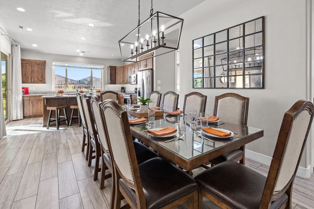 Extended dining table seating ten beside the kitchen