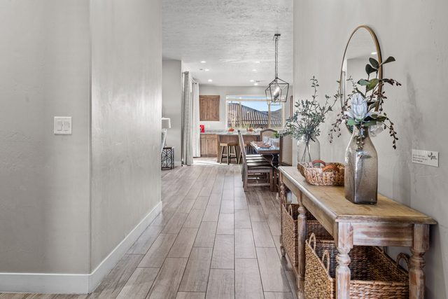 Entry hallway with console table leading toward the kitchen