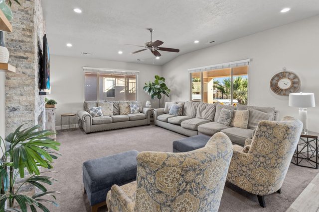Spacious family room with plush sofas and accent armchairs