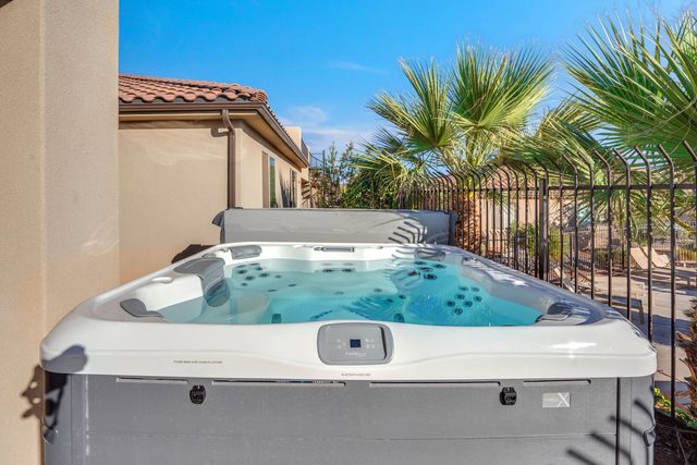 Private Bullfrog hot tub on the back patio