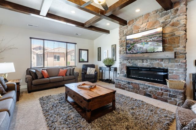 Living room sofa and wood coffee table beside the fireplace