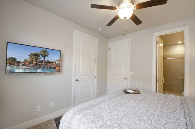 King bedroom TV and doorway to the ensuite bathroom