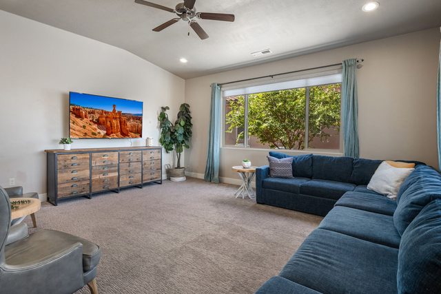 Living room with large sectional sofa and wall-mounted TV