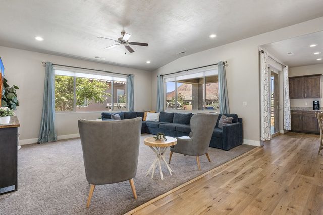 Living room seating area with windows to the patio