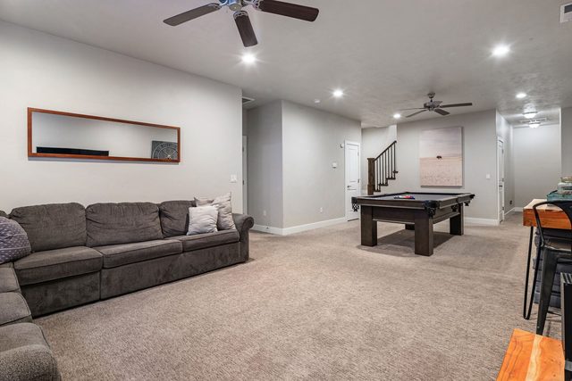 Downstairs loft with sofa, pool table and bar seating