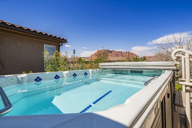 Private swim spa at Paradise Village 16 with mountain backdrop