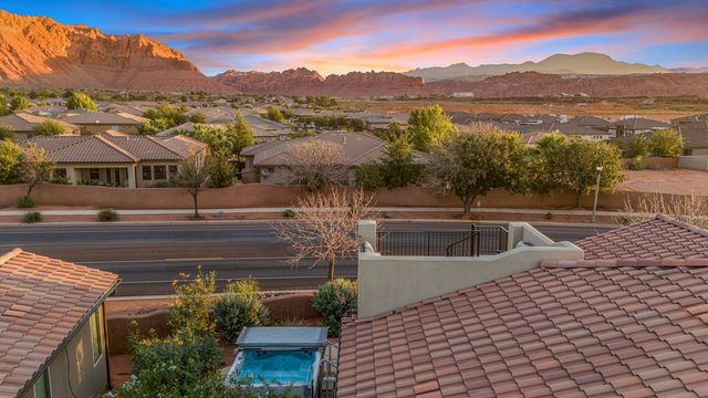 Rooftop view over the swim spa toward red rock mountains