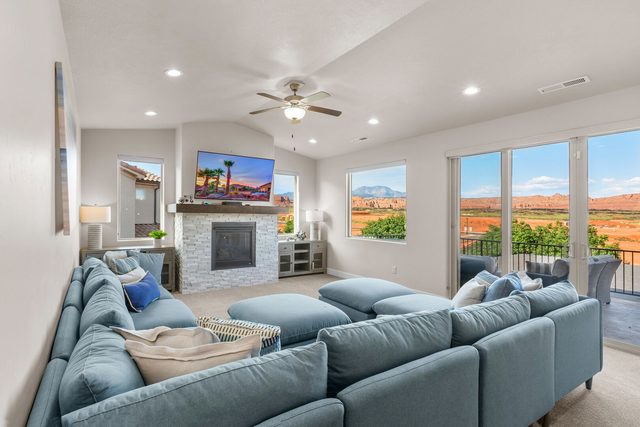 Unit 19 upstairs family room with fireplace and desert views