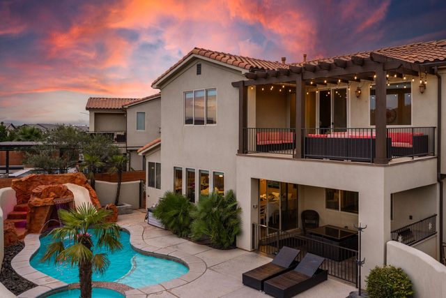 Two-story rear exterior with balcony above the private pool