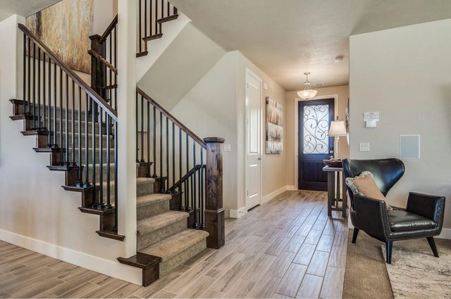 Entry hall with staircases and leather reading chairs