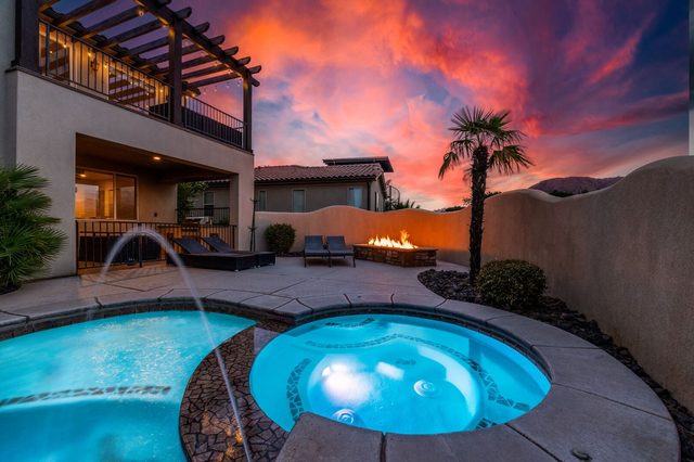 Private hot tub and pool with fire pit under pergola
