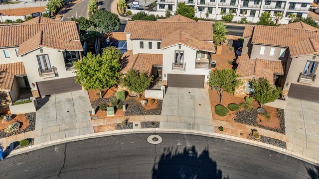 Aerial of the home's driveway and street frontage