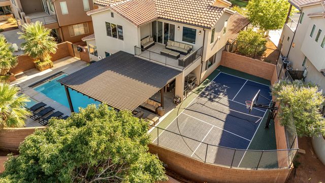 Aerial showing private pool, pergola and sport court
