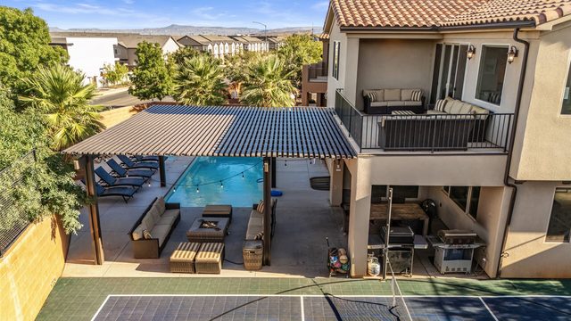Rear of the home with balcony, pergola and pool