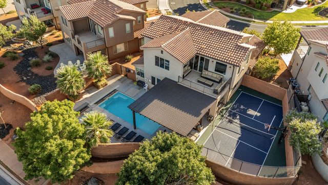 Aerial of home, backyard pool and sport court