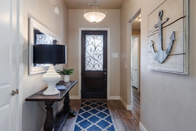 Entry hall with console table and decorative door at Paradise Village 28