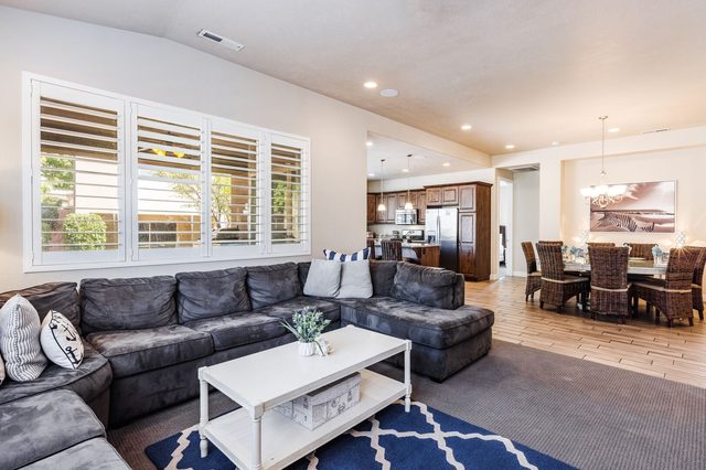 Sectional sofa facing kitchen and dining area at Paradise Village 28