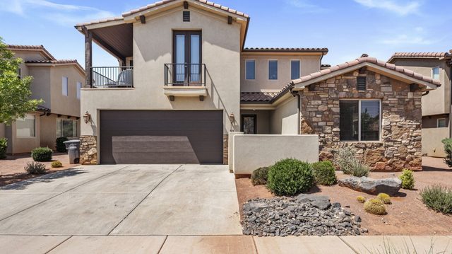 Front exterior and two-car garage of home 32 at the retreat
