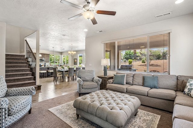 Living room opening to staircase and dining area