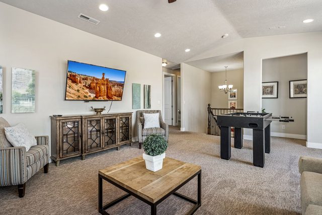 Loft sitting area with smart TV and foosball table