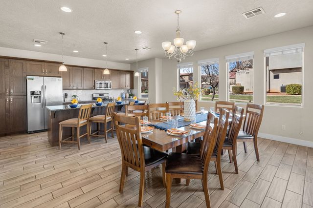 Open kitchen and dining table for ten at Paradise Village 36