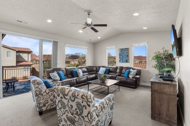 Upstairs loft with leather sectional and smart TV at Paradise Village 36